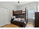 bedroom with ceiling fan, window, hardwood floors and bunk beds with drawers at 387 Devon Pl, Lake Mary, FL 32746