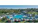 Aerial view of community pool, cabanas, lounge chairs, and landscaping at 387 Devon Pl, Lake Mary, FL 32746