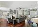 Spacious living room with hardwood floors, fireplace, dining area and kitchen views at 387 Devon Pl, Lake Mary, FL 32746