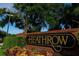 Community sign for Heathrow with brick and colorful landscaping at 387 Devon Pl, Lake Mary, FL 32746