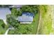 Aerial view of a beautiful landscaped property with a patio area at 42 W Grenewood Ln, Haines City, FL 33844