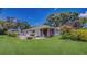 Backyard with patio, seating area, and lush landscaping perfect for relaxing at 42 W Grenewood Ln, Haines City, FL 33844