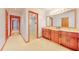 Spacious bathroom with double sink vanity, shower with glass door, and toilet at 42 W Grenewood Ln, Haines City, FL 33844