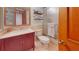 A bathroom with a marble vanity, toilet, and shower with a glass door at 42 W Grenewood Ln, Haines City, FL 33844