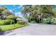 Charming home featuring a well-manicured front yard and mature trees at 42 W Grenewood Ln, Haines City, FL 33844