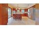 Spacious kitchen featuring tile floors, stainless steel appliances, a large island with seating, and ample counter space at 42 W Grenewood Ln, Haines City, FL 33844