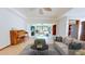 Spacious living room boasting tile floors, neutral walls, and large windows that flood the space with natural light at 42 W Grenewood Ln, Haines City, FL 33844