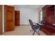 An office space with wooden cabinets, a desk, an office chair, and two wooden doors at 42 W Grenewood Ln, Haines City, FL 33844