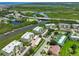 An aerial view of condos showcases waterfront views, lush greenery, and convenient parking, offering a desirable living environment at 426 Bouchelle Dr # 202, New Smyrna Beach, FL 32169