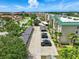 An aerial view showcases condo buildings, convenient parking, and lush landscaping, providing a comfortable and inviting community atmosphere at 426 Bouchelle Dr # 202, New Smyrna Beach, FL 32169