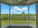 Enjoy this balcony view of the lush foliage and waterfront view at 426 Bouchelle Dr # 202, New Smyrna Beach, FL 32169