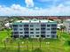 Well-maintained condo building with tropical landscaping and screened in balconies at 426 Bouchelle Dr # 202, New Smyrna Beach, FL 32169