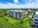 Well-maintained condo building with tropical landscaping and screened in balconies at 426 Bouchelle Dr # 202, New Smyrna Beach, FL 32169