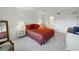 Comfortable bedroom with elegant decor, featuring a plush bed and stylish bedside tables at 426 Bouchelle Dr # 202, New Smyrna Beach, FL 32169