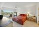 Bright bedroom with a large window, desk, and comfortable bed perfect for relaxation at 426 Bouchelle Dr # 202, New Smyrna Beach, FL 32169