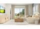 Bright, open-concept living area with a comfortable sofa and modern decor at 4333 Curacao Pl, Kissimmee, FL 34758