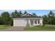 Charming single-Gathering home with a well-manicured lawn, a two-car garage and a beautiful front door at 4596 Ochos Rios Pl, Kissimmee, FL 34758