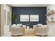 Relaxing living room area with comfortable chairs, a coffee table, and stylish wall art at 4596 Ochos Rios Pl, Kissimmee, FL 34758