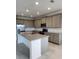 Modern kitchen featuring stainless steel appliances and spacious granite countertops at 483 Shadow Gorge Way, Eustis, FL 32736