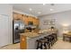 Well-equipped kitchen with granite countertops, stainless steel appliances, and a breakfast bar for casual dining at 4895 Clock Tower Dr, Kissimmee, FL 34746