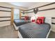 Striking bedroom with striped walls, custom Disney decor, and comfortable twin beds at 5025 Windermere Ave, Kissimmee, FL 34746