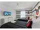 Well-lit bedroom featuring two twin beds, TV, and Mickey Mouse themed wall art at 5025 Windermere Ave, Kissimmee, FL 34746