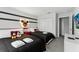 This bedroom offers two twin beds, black bedding, closet, and fun Mickey Mouse decorations at 5025 Windermere Ave, Kissimmee, FL 34746