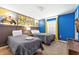 This bedroom offers two twin beds with colorful Minions decor and a TV screen at 5025 Windermere Ave, Kissimmee, FL 34746
