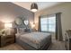 Serene bedroom with a comfortable bed, stylish lighting, and modern décor for a relaxing retreat at 5025 Windermere Ave, Kissimmee, FL 34746