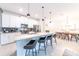Spacious kitchen island perfect for seating and food preparation, seamlessly connecting to the dining area at 5025 Windermere Ave, Kissimmee, FL 34746