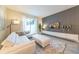 Inviting living room featuring a modern sofa, media console, and seamless access to outdoor spaces at 5025 Windermere Ave, Kissimmee, FL 34746