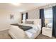 Charming main bedroom featuring an accent wall and bedside tables with lamps at 5025 Windermere Ave, Kissimmee, FL 34746