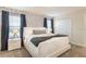 Beautiful main bedroom featuring a geometrically designed accent wall and soft, natural lighting at 5025 Windermere Ave, Kissimmee, FL 34746