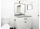 Updated bathroom features a modern vanity with gray counters and black hardware at 5160 Conroy Rd # 21, Orlando, FL 32811