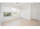Bright bedroom with natural light, a large closet, and sleek flooring providing a clean, minimalist space at 5160 Conroy Rd # 21, Orlando, FL 32811