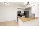 Bright kitchen with white cabinets, granite countertops, stainless steel appliances and open to living area at 5160 Conroy Rd # 21, Orlando, FL 32811