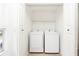 Convenient laundry room with modern washer and dryer and ample shelving at 5160 Conroy Rd # 21, Orlando, FL 32811