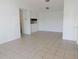 Spacious living area featuring tile flooring, neutral walls, and ample natural light at 5220 Via Hacienda # 212, Orlando, FL 32839
