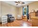 Comfortable bedroom with two cozy chairs and plenty of natural light, creating a relaxing space at 5263 Beach River Road, Windermere, FL 34786
