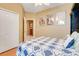 Cozy bedroom featuring an adjacent doorway and a bright, airy atmosphere at 5263 Beach River Road, Windermere, FL 34786