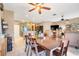Open-concept dining area connecting to the kitchen and living room with a large table at 5263 Beach River Road, Windermere, FL 34786