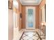 Elegant foyer with decorative tile flooring and a stylish frosted glass front door at 5263 Beach River Road, Windermere, FL 34786