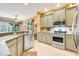 Bright kitchen featuring stainless steel appliances and a view of the breakfast nook at 5263 Beach River Road, Windermere, FL 34786