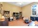 Bright office with modern wood laminate flooring, updated lighting, and a view of the outdoors at 5263 Beach River Road, Windermere, FL 34786