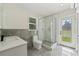 Updated bathroom featuring a glass-enclosed shower and modern vanity at 5521 Makoma Dr, Orlando, FL 32839