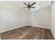 Well-lit bedroom with a ceiling fan and wood-look floors at 5521 Makoma Dr, Orlando, FL 32839
