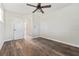 Empty bedroom featuring wood-look floors and a ceiling fan at 5521 Makoma Dr, Orlando, FL 32839