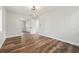 Bedroom with wood-look flooring, sliding closet doors, and a modern ceiling fan at 5521 Makoma Dr, Orlando, FL 32839