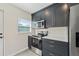 Close-up of the kitchen highlighting modern appliances and stylish cabinetry with gold handles at 5521 Makoma Dr, Orlando, FL 32839