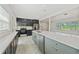Spacious kitchen island with modern fixtures, offering ample workspace and stylish design at 5521 Makoma Dr, Orlando, FL 32839
